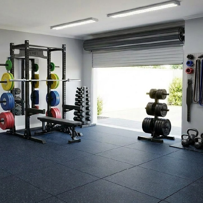 Home gym setup with rubber flooring tiles and workout equipment