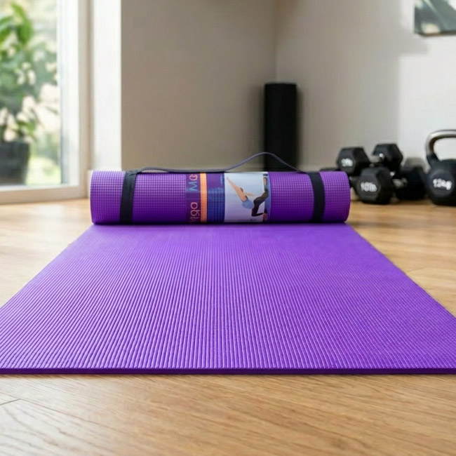 Yoga mat laid out in a home gym ready for a workout