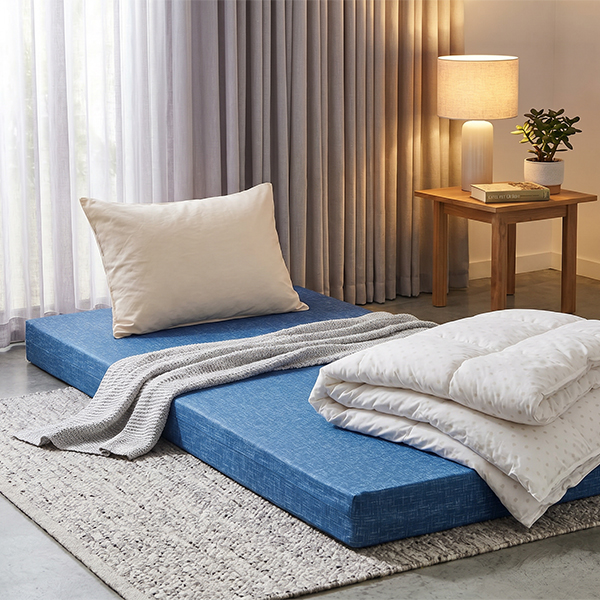 Foam mattress styled in a simple guest bedroom setup