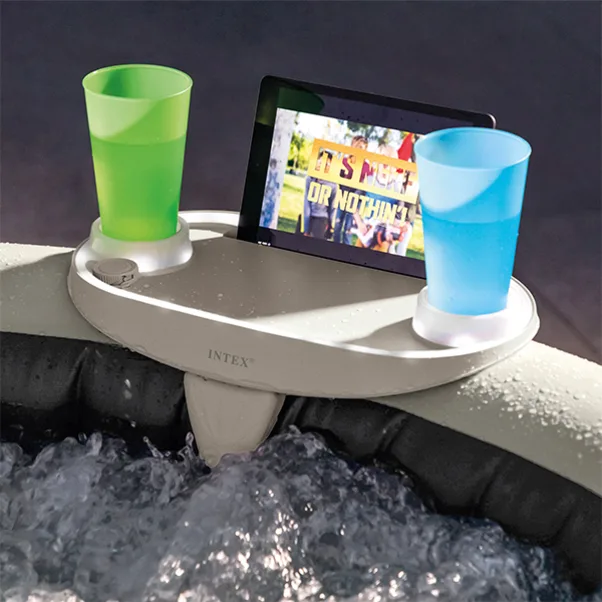 Spa tray holding drinks and snacks while attached to an inflatable spa. Spa tray keeping drinks and personal items within easy reach.