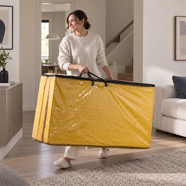 Tri fold mattress being carried and folded for easy storage in Australian home