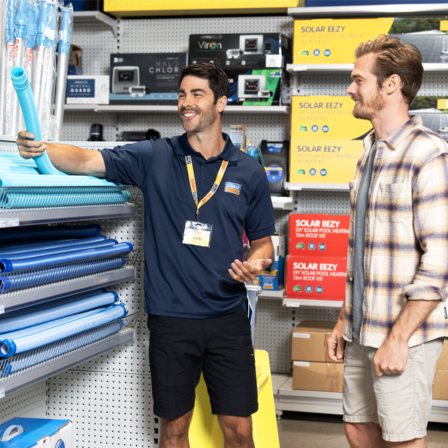 Customer choosing a suction pool cleaner for home use