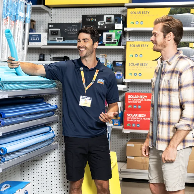 Customer choosing a suction pool cleaner for home use